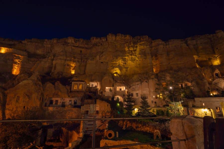 Historic cave hotel Yunak Evleri in Cappadocia, Turkey, featuring stone arches and rustic charm.