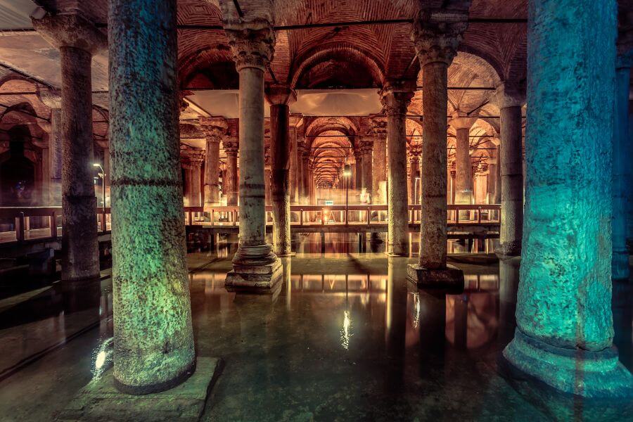 Ancient underground cistern in Istanbul, featuring grand columns, dim lighting, and a serene, historical ambiance.