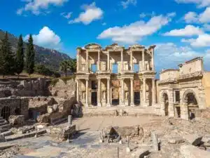 Ephesus Ancient City Ruins with well-preserved columns, pathways, and historical structures under a clear sky.