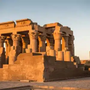 The magnificent Temple of Kom Ombo in Egypt, a symmetrical ancient structure with detailed carvings and columns dedicated to the gods Sobek and Horus.