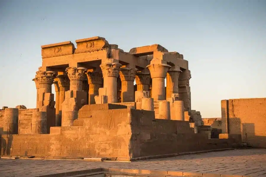 The magnificent Temple of Kom Ombo in Egypt, a symmetrical ancient structure with detailed carvings and columns dedicated to the gods Sobek and Horus.