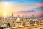 Panoramic view of Islamic Cairo, featuring historic mosques, bustling markets, and traditional Islamic architecture.
