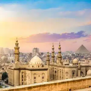 Panoramic view of Islamic Cairo, featuring historic mosques, bustling markets, and traditional Islamic architecture.