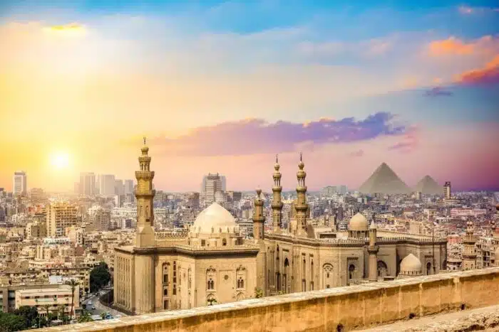 Panoramic view of Islamic Cairo, featuring historic mosques, bustling markets, and traditional Islamic architecture.