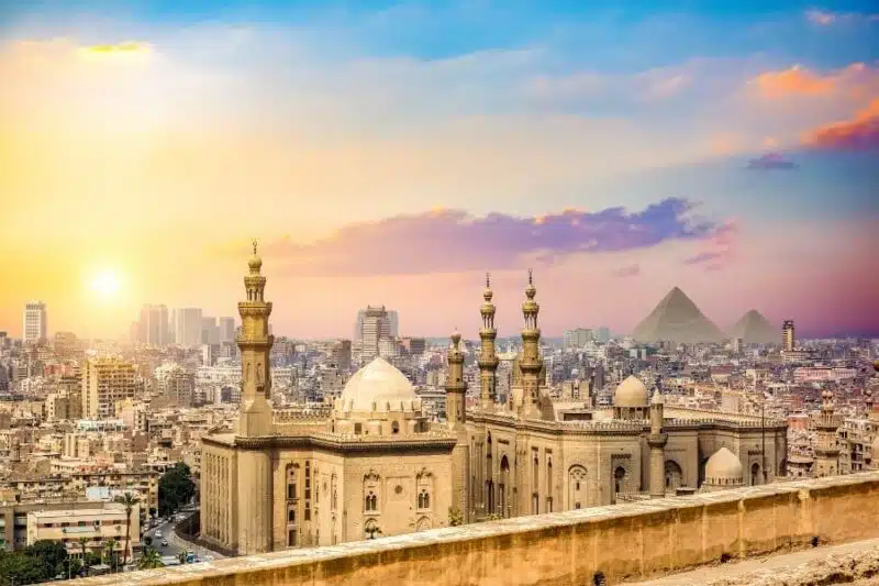 Panoramic view of Islamic Cairo, featuring historic mosques, bustling markets, and traditional Islamic architecture.