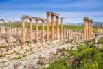 Exploring the ancient ruins of Jerash, Jordan with columns and arches
