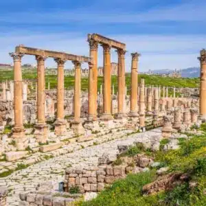 Exploring the ancient ruins of Jerash, Jordan with columns and arches