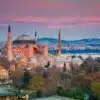 Exterior of Hagia Sophia with its massive domes and minarets, blending Byzantine and Islamic architectural styles.
