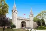 Ornate main entrance of Topkapi Palace Museum, featuring grand arches and intricate Islamic art details.