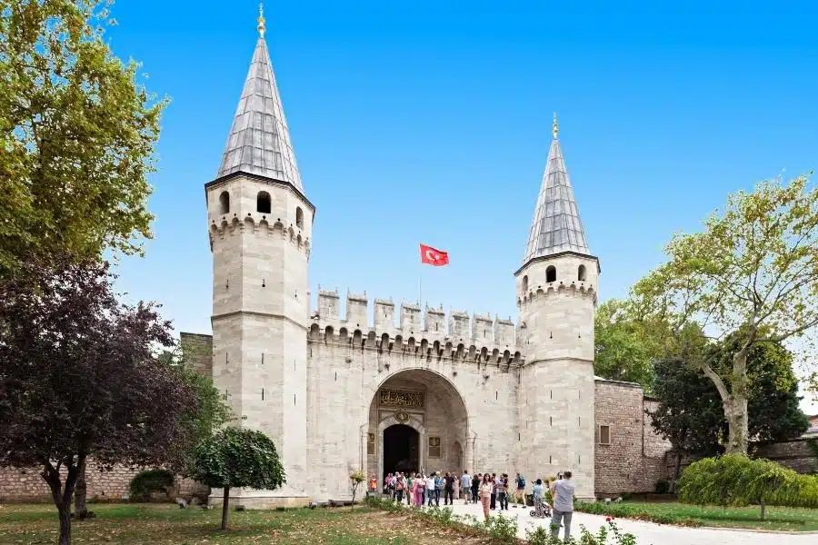 Ornate main entrance of Topkapi Palace Museum, featuring grand arches and intricate Islamic art details.