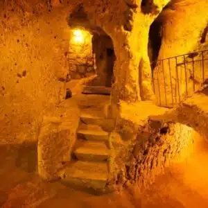 Interior of Kaymaklı Underground City, showcasing narrow passageways and carved stone rooms