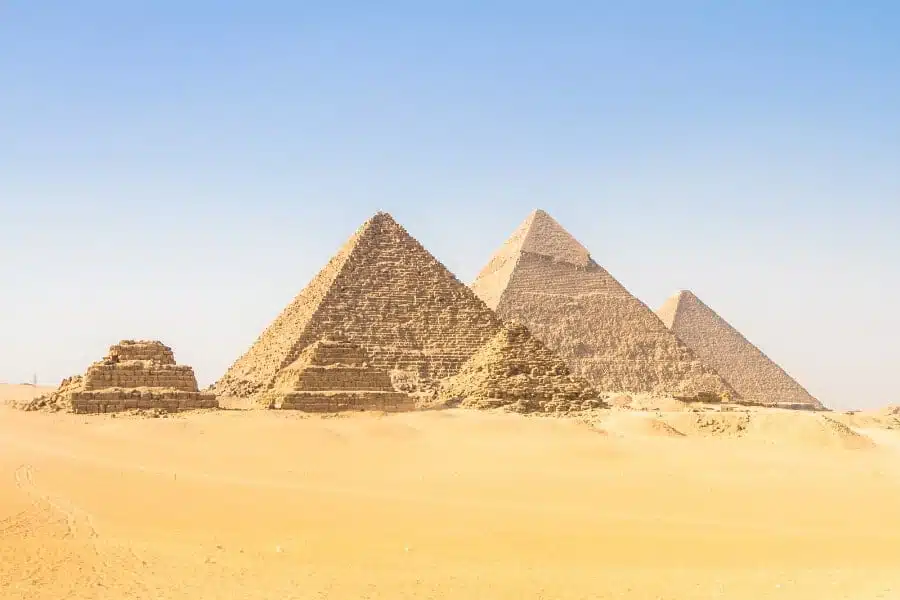 Majestic Great Pyramid of Cheops, ancient stone structure under clear skies.