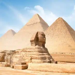 Limestone Great Sphinx of Giza statue under clear sky, showcasing ancient Egyptian craftsmanship.