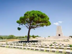Group of tourists on a Gallipoli Tour from Istanbul, standing at historical battlefields and memorials, reflecting on World War I history.