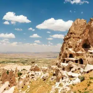 View of Uchisar Castle in Cappadocia, showcasing its unique rock formations and towers.