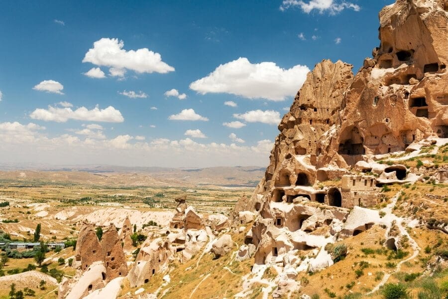 View of Uchisar Castle in Cappadocia, showcasing its unique rock formations and towers.