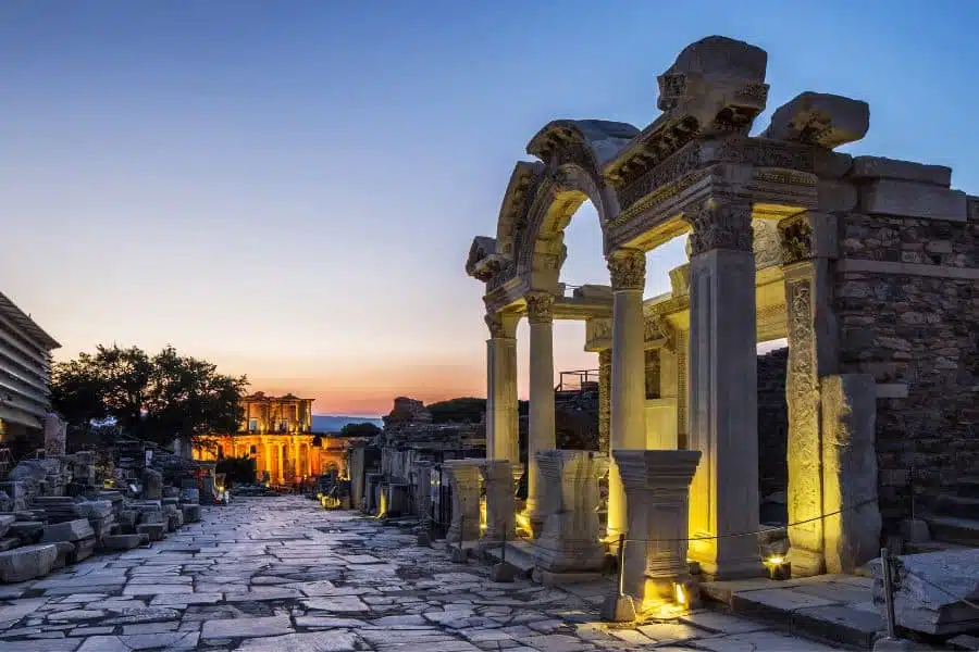 Ruins of the Temple of Hadrian in Ephesus, featuring intricate stone carvings and ancient columns.