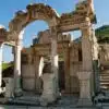 Ruins of the Temple of Hadrian in Ephesus, featuring ornate stone carvings and classical columns.