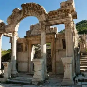 Ruins of the Temple of Hadrian in Ephesus, featuring ornate stone carvings and classical columns.