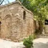 Scenic view of the House of the Virgin Mary, surrounded by lush greenery and historical architecture