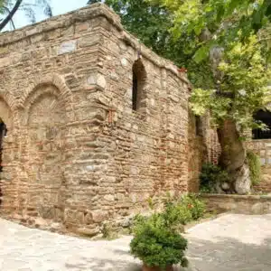 Scenic view of the House of the Virgin Mary, surrounded by lush greenery and historical architecture