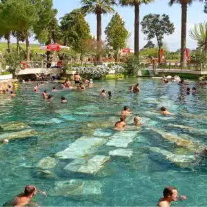 Antique Cleopatra-inspired pool with detailed hieroglyphics and classic stone texture.