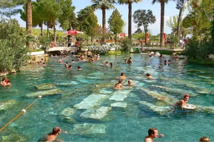 Antique Cleopatra-inspired pool with detailed hieroglyphics and classic stone texture.