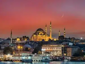 Süleymaniye Mosque in Istanbul, with its impressive domes and minarets, seen from the sea.