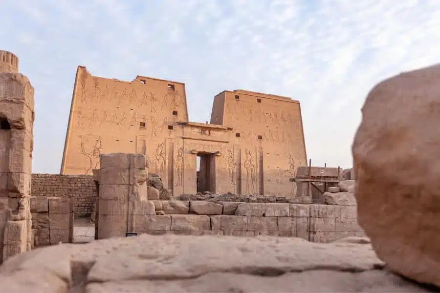 Ancient Temple of Edfu in Egypt, with large stone entrance and hieroglyphic inscriptions.