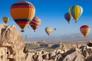 Scenic hot air balloon ride over the unique rock formations of Cappadocia, Turkey.