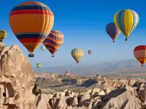 Scenic hot air balloon ride over the unique rock formations of Cappadocia, Turkey.