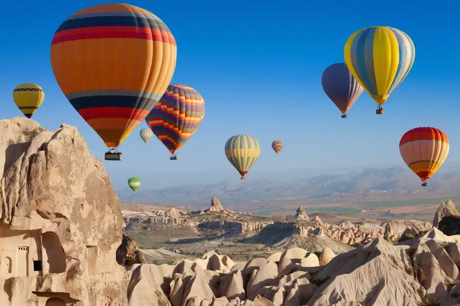 Scenic hot air balloon ride over the unique rock formations of Cappadocia, Turkey.