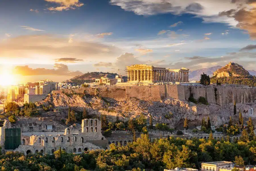 Aerial view of the Acropolis of Athens, showcasing the Parthenon and other ancient structures on a rocky hilltop.