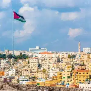 Cover of 'The Ultimate Amman City Guide' showcasing Amman's cityscape, including key landmarks and cultural highlights.