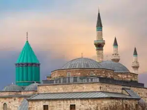 Alaeddin Mosque in Konya, a historic structure with distinctive Seljuk architecture, featuring a large courtyard and intricate stonework.