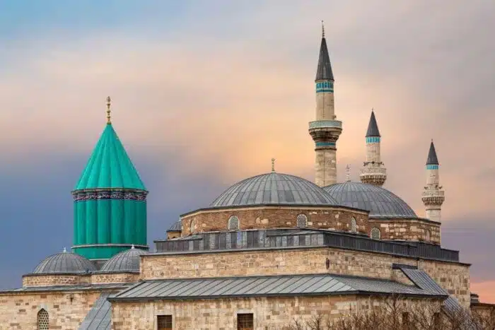Alaeddin Mosque in Konya, a historic structure with distinctive Seljuk architecture, featuring a large courtyard and intricate stonework.