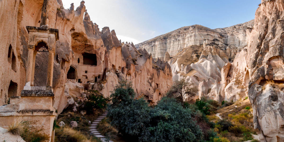 Pathway leading to ancient rock-cut dwellings in Zelve Open Air Museum, Cappadocia.