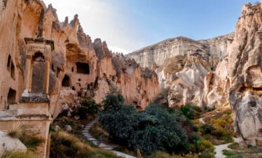 Pathway leading to ancient rock-cut dwellings in Zelve Open Air Museum, Cappadocia.