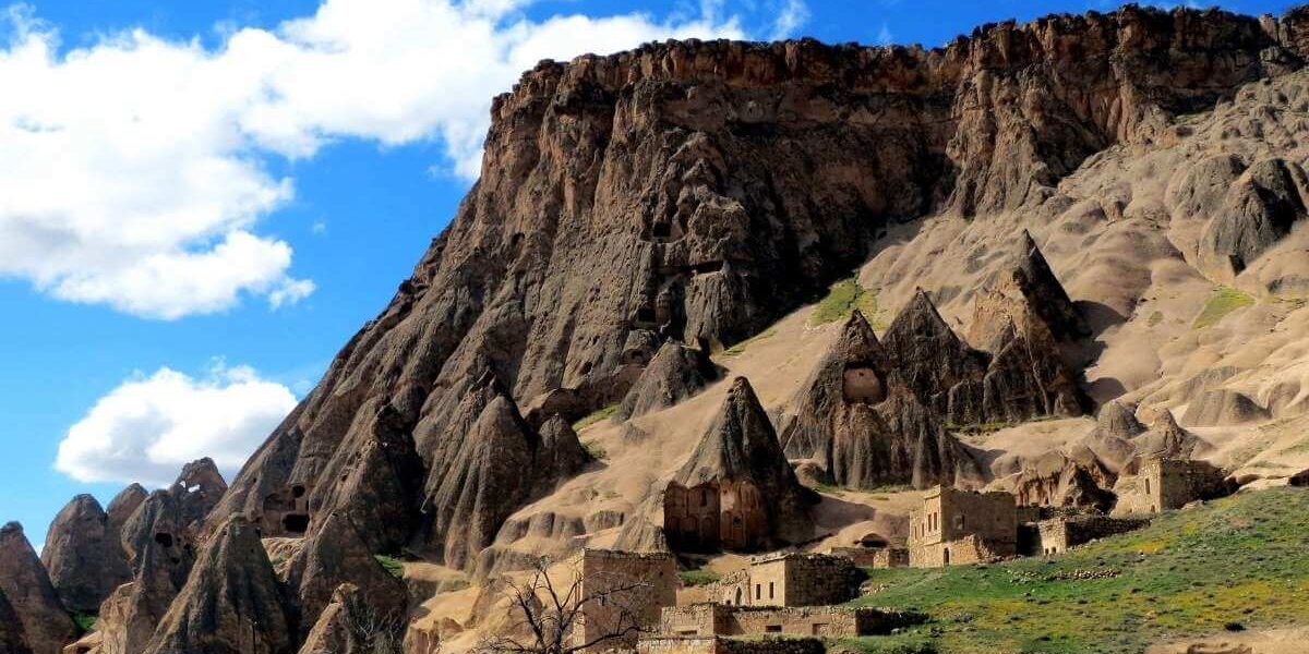 Selime Monastery and surrounding fairy chimneys carved into volcanic rock in Cappadocia, Turkey.