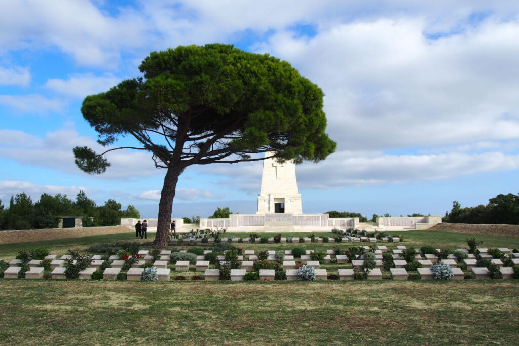 Lone Pine Cemetery and Memorial with a large pine tree and soldier graves in Gallipoli Peninsula, Çanakkale, Turkey.