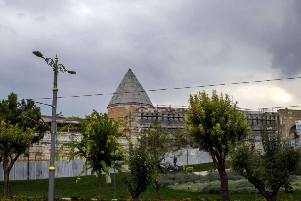 Alaaddin Mosque in Konya, Turkey, under restoration, with Seljuk-style conical dome and stone architecture.