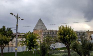 Alaaddin Mosque in Konya, Turkey, under restoration, with Seljuk-style conical dome and stone architecture.