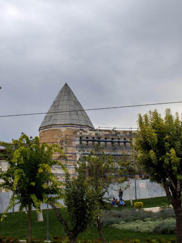 Alaaddin Mosque in Konya, Turkey, under restoration, with Seljuk-style conical dome and stone architecture.