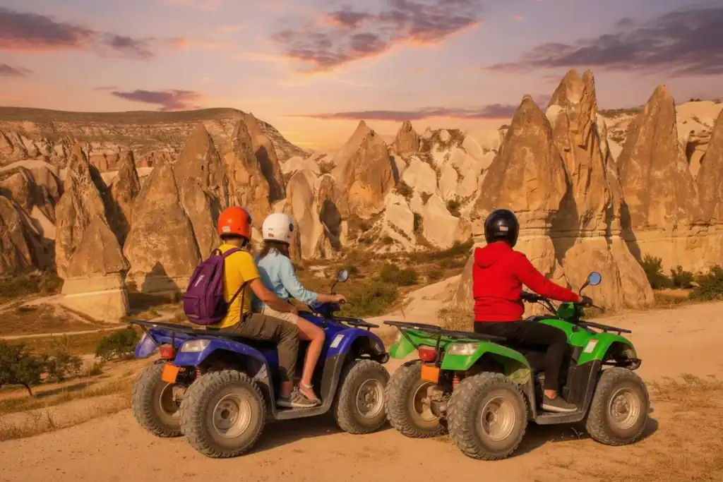 How to Spend 4 Days in Cappadocia — Here's the Day-by-Day Schedule That Never Disappoints 4 Two riders on a blue ATV and one rider on a green ATV pause on a dirt path to view the unique rock formations of Cappadocia, Turkey, under a dramatic orange and purple sunset sky.