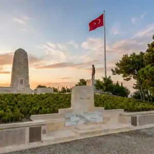 Sunset view of the Australian Memorial and Turkish flag at Gallipoli on a day tour from Istanbul.
