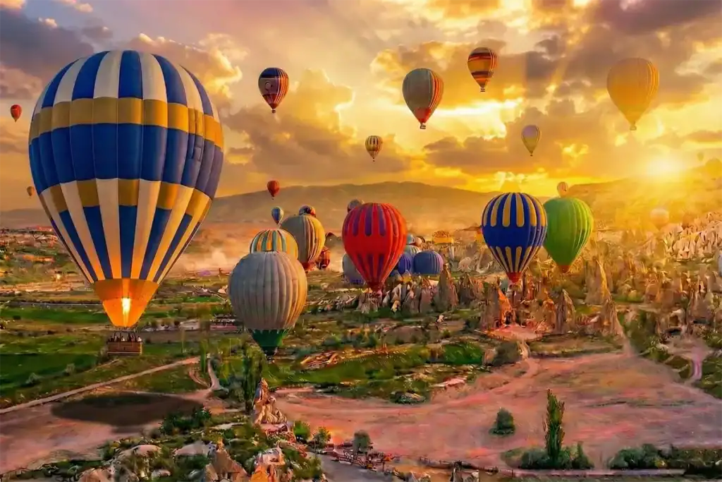 Colorful hot air balloons at sunrise in Cappadocia Turkey - Best of Istanbul and Cappadocia tours by One Nation Travel