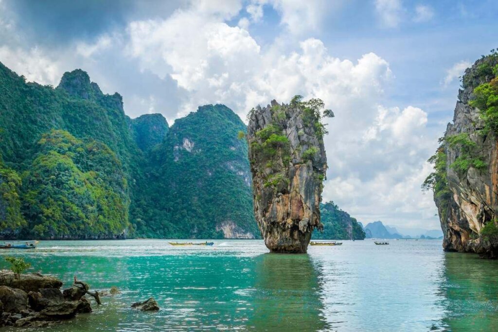 Iconic limestone karst of James Bond Island rising from turquoise waters in Phang Nga Bay, Thailand.