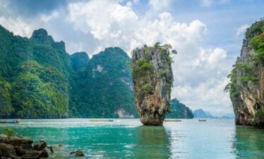 Iconic limestone karst of James Bond Island rising from turquoise waters in Phang Nga Bay, Thailand.