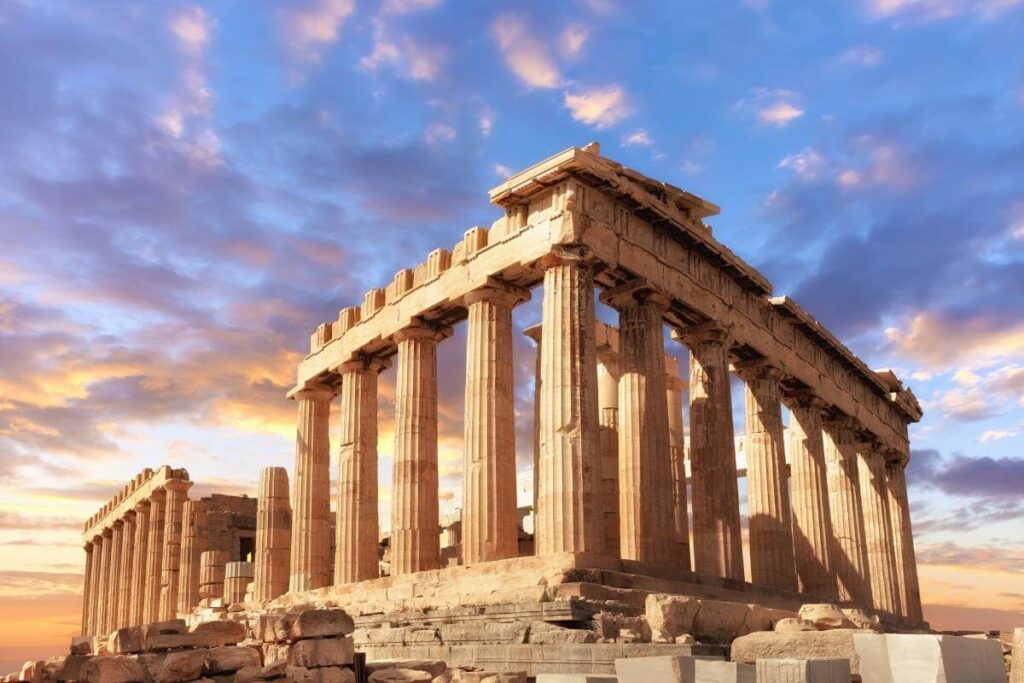 Majestic Parthenon temple in Athens with golden sunlight and vibrant sky highlighting its classical columns.