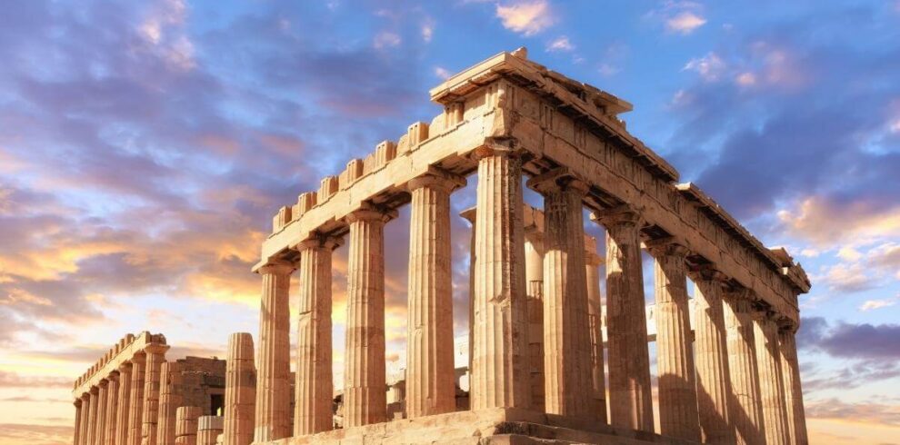 Majestic Parthenon temple in Athens with golden sunlight and vibrant sky highlighting its classical columns.